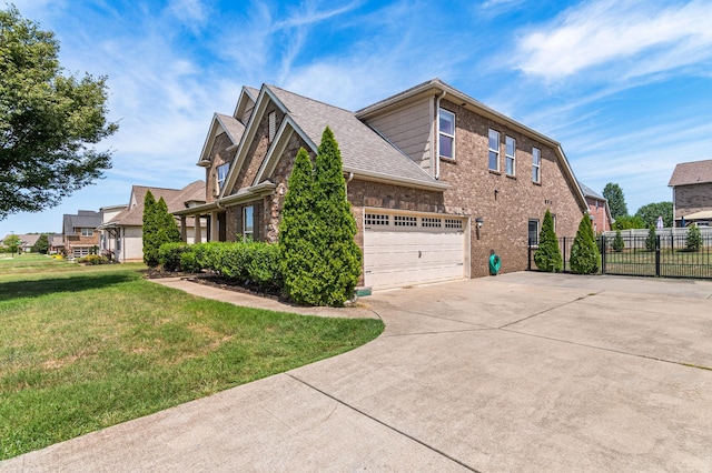 view of home's exterior featuring a garage, a lawn, concrete driveway, fence, and brick siding