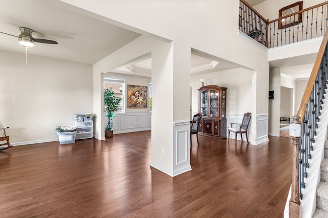 living room with dark hardwood / wood-style floors and ceiling fan