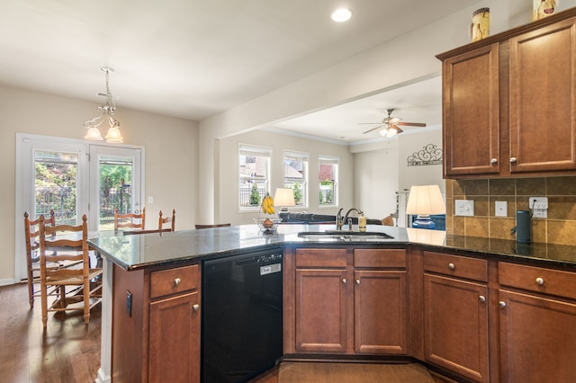 kitchen with black dishwasher, dark hardwood / wood-style flooring, sink, and a healthy amount of sunlight