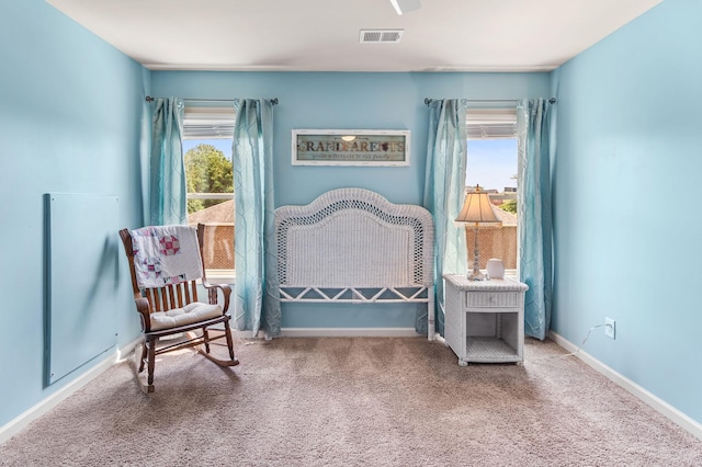 interior space featuring multiple windows, visible vents, and baseboards