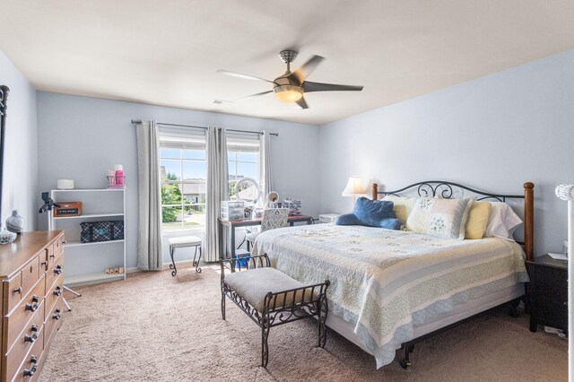 bedroom with ceiling fan and carpet floors