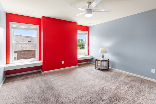 interior space featuring ceiling fan and carpet floors