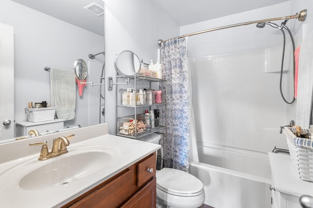 full bath with toilet, vanity, visible vents, and shower / tub combo with curtain