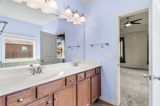 bathroom featuring dual vanity, ceiling fan, and tile patterned floors