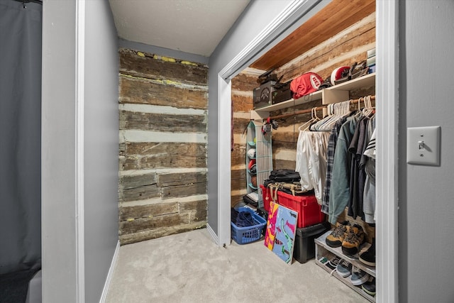 walk in closet featuring carpet floors