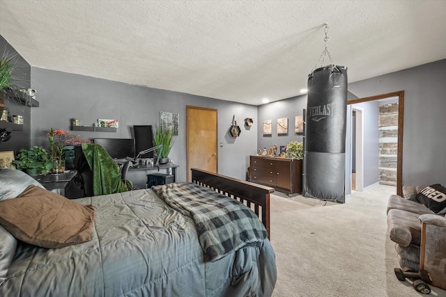 bedroom with light carpet and a textured ceiling