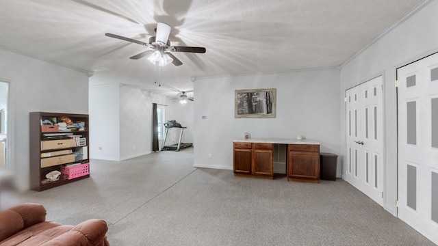 living room featuring a textured ceiling, ceiling fan, and ornamental molding