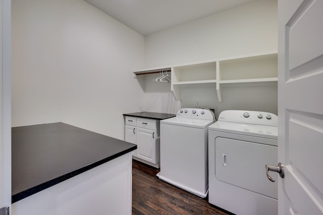 laundry room featuring washer and dryer, cabinets, dark hardwood / wood-style flooring, and hookup for a washing machine