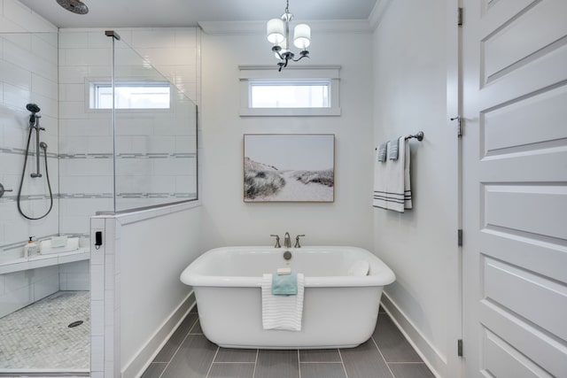 bathroom with crown molding, tile flooring, independent shower and bath, and a notable chandelier