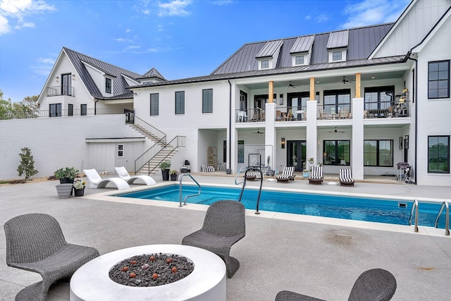 view of pool featuring a patio area and ceiling fan