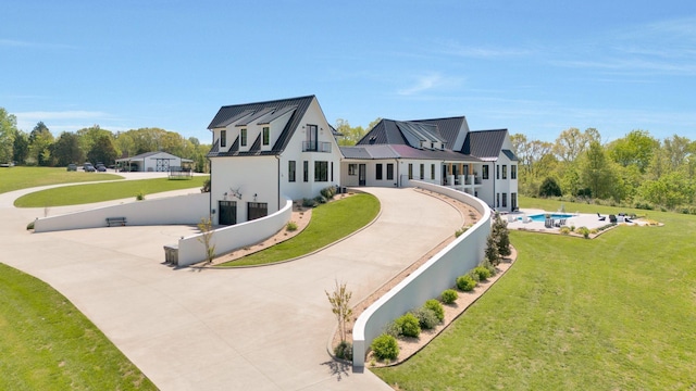 back of house featuring a yard