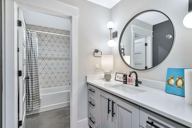 bathroom featuring tile patterned floors, vanity, and shower / bath combo with shower curtain