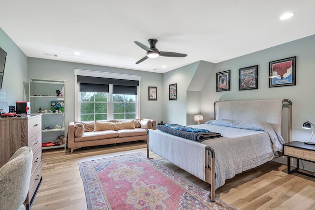 bedroom with light hardwood / wood-style flooring and ceiling fan