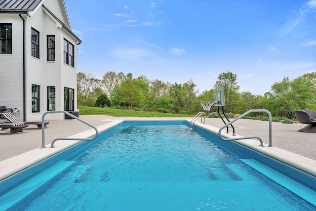 view of pool featuring a patio