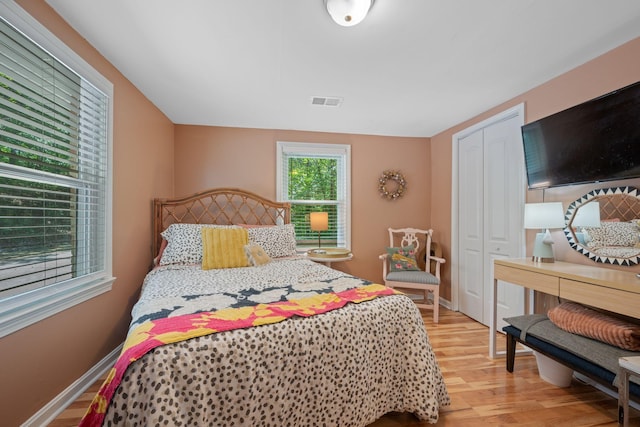 bedroom with a closet and light wood-type flooring