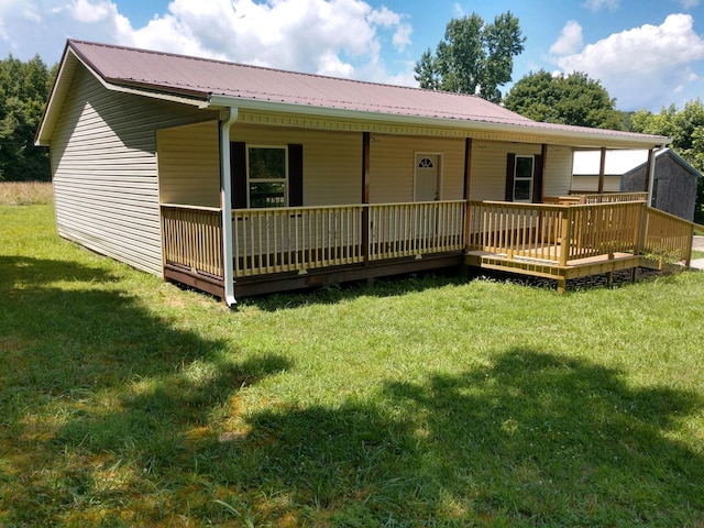 rear view of house with a lawn