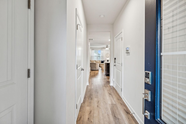 corridor featuring light hardwood / wood-style flooring