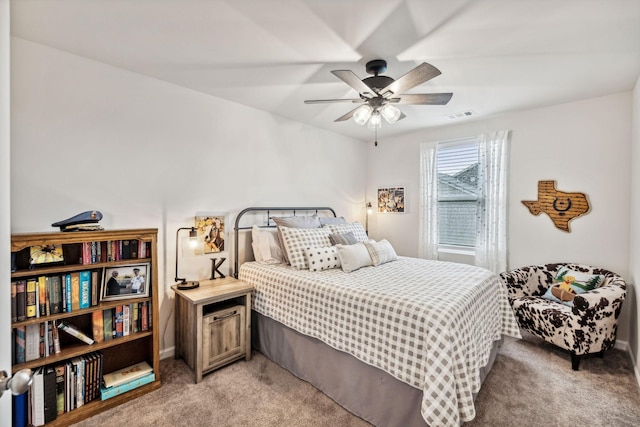 bedroom with ceiling fan and light carpet