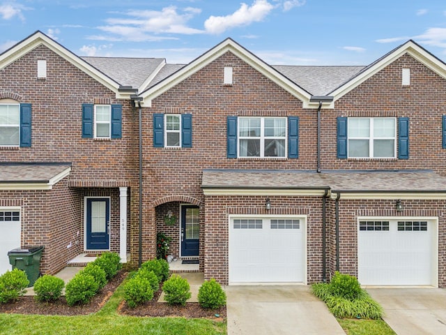 townhome / multi-family property featuring a garage