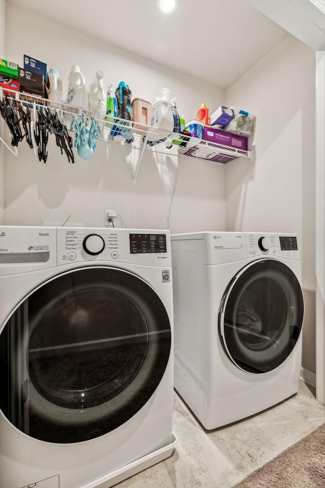 laundry room with washer and clothes dryer