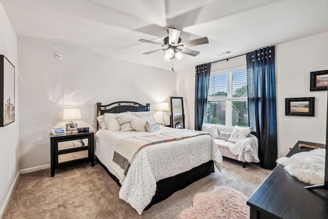 bedroom featuring ceiling fan and light carpet