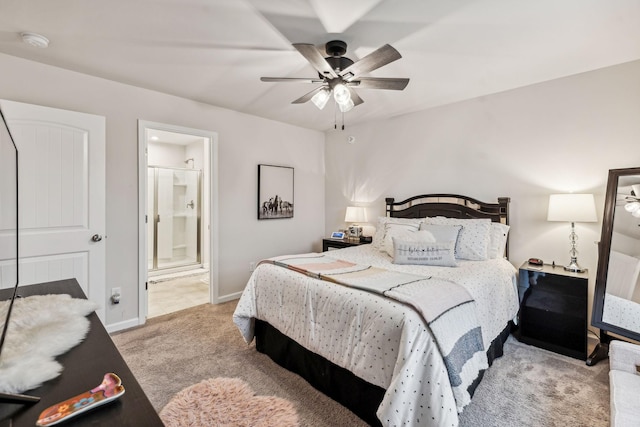 carpeted bedroom featuring ceiling fan and ensuite bathroom