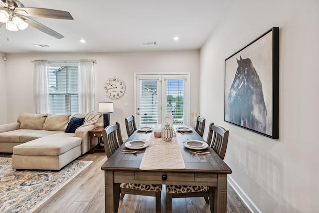 dining space featuring ceiling fan, plenty of natural light, and hardwood / wood-style floors