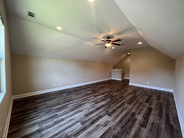 additional living space featuring ceiling fan, dark hardwood / wood-style flooring, and vaulted ceiling