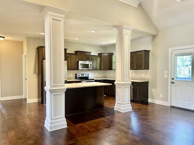 kitchen with dark hardwood / wood-style floors, a center island, dark brown cabinetry, and stainless steel appliances