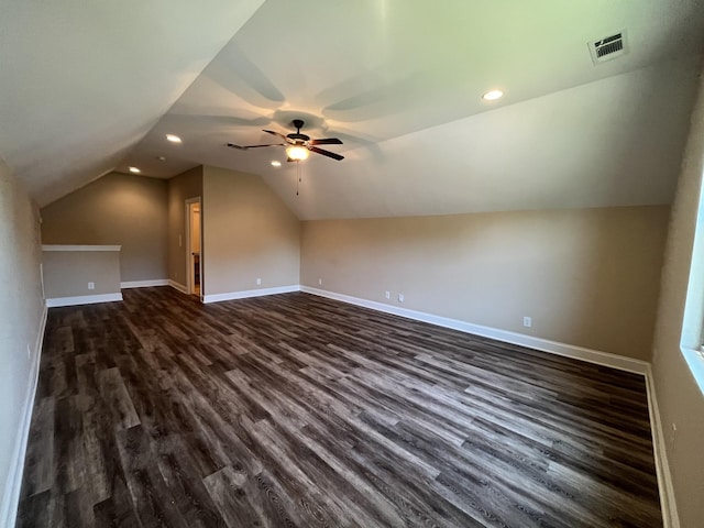 bonus room featuring dark hardwood / wood-style flooring, vaulted ceiling, and ceiling fan