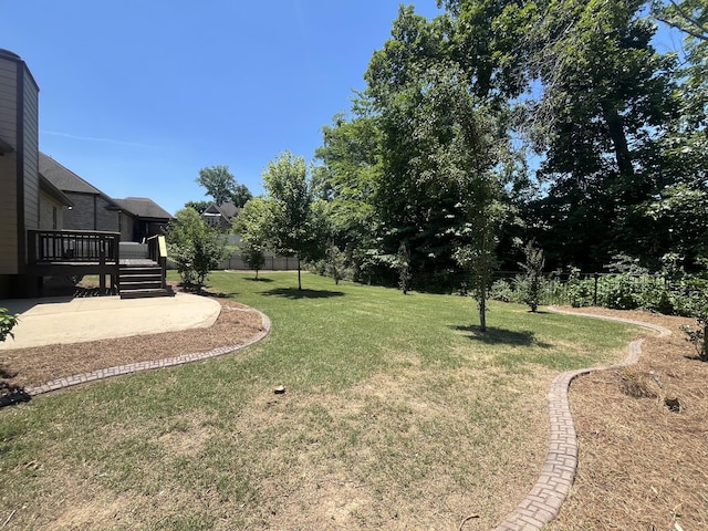 view of yard with a deck