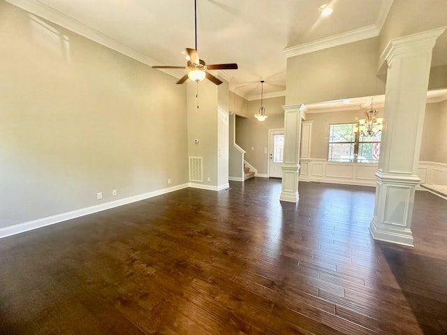 unfurnished living room featuring ceiling fan with notable chandelier, dark hardwood / wood-style flooring, and crown molding