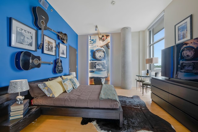 bedroom with light hardwood / wood-style floors