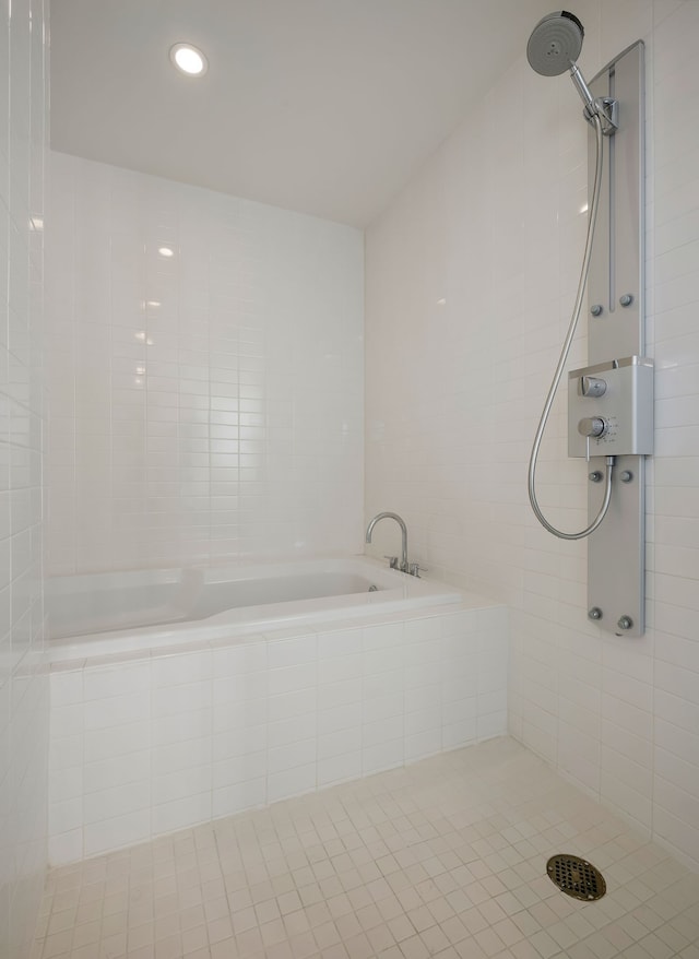 bathroom with tiled shower