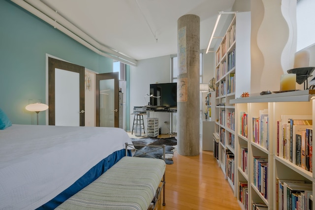 bedroom with wood-type flooring