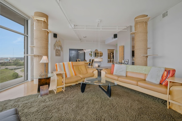 living room with floor to ceiling windows