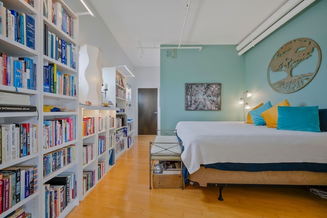 bedroom with hardwood / wood-style floors