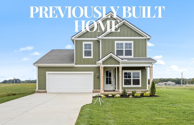 craftsman-style house featuring a garage and a front lawn