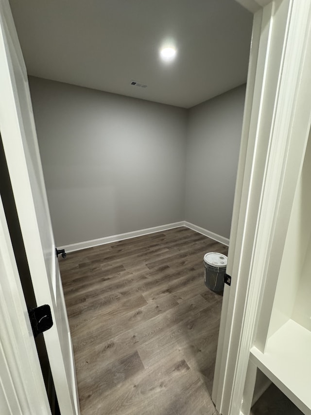 empty room with wood-type flooring