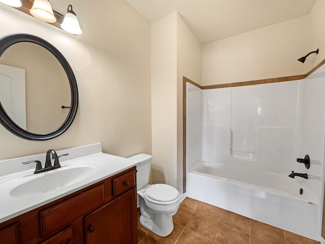 full bathroom with tile patterned floors, toilet, vanity, and washtub / shower combination