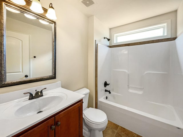 full bathroom with washtub / shower combination, vanity, tile patterned floors, and toilet