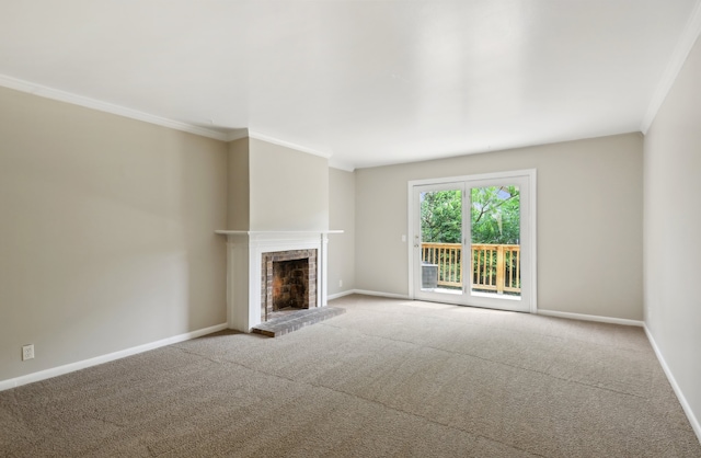 unfurnished living room with crown molding, carpet, and a brick fireplace