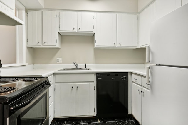 kitchen with extractor fan, white cabinetry, dark tile flooring, sink, and white appliances