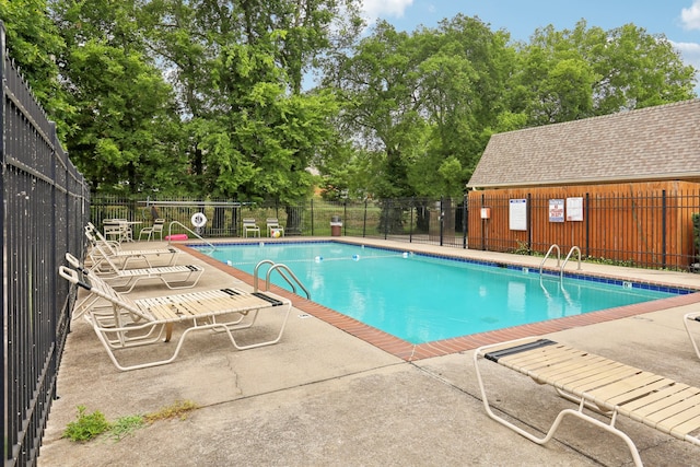 view of swimming pool with a patio area