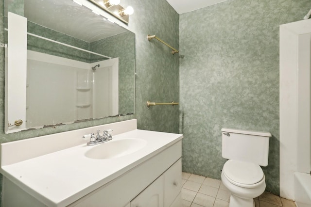 bathroom with vanity, tile patterned flooring, walk in shower, and toilet