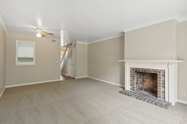 unfurnished living room with carpet flooring, ornamental molding, ceiling fan, and a fireplace