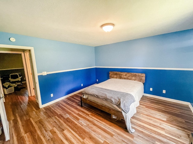 bedroom featuring hardwood / wood-style flooring