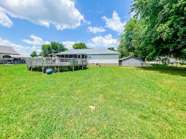 view of yard with a wooden deck