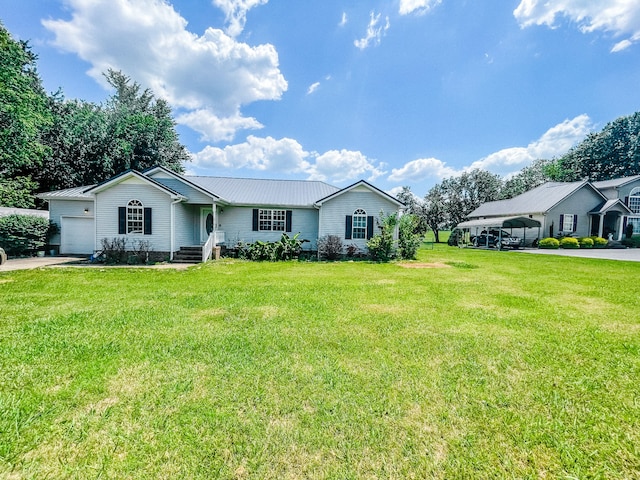 ranch-style home with a front yard and a garage