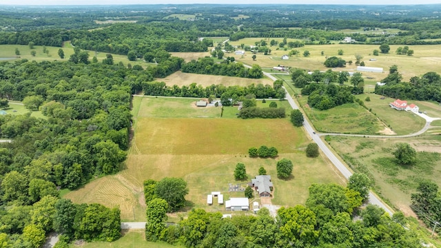 birds eye view of property with a rural view